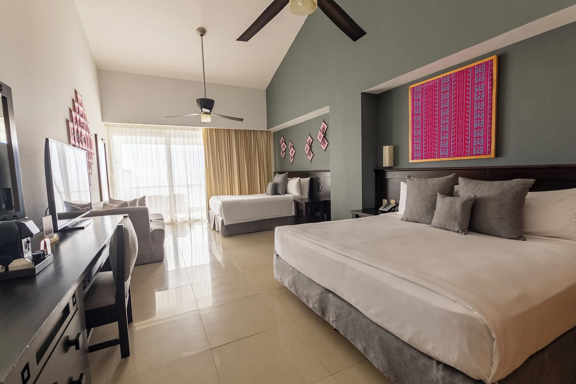 Fiesta Club Junior Suite Ocean View at Fiesta Americana Riviera Nayarit Resort & Spa with multiple beds, spacious layout, and ocean view ambiance.