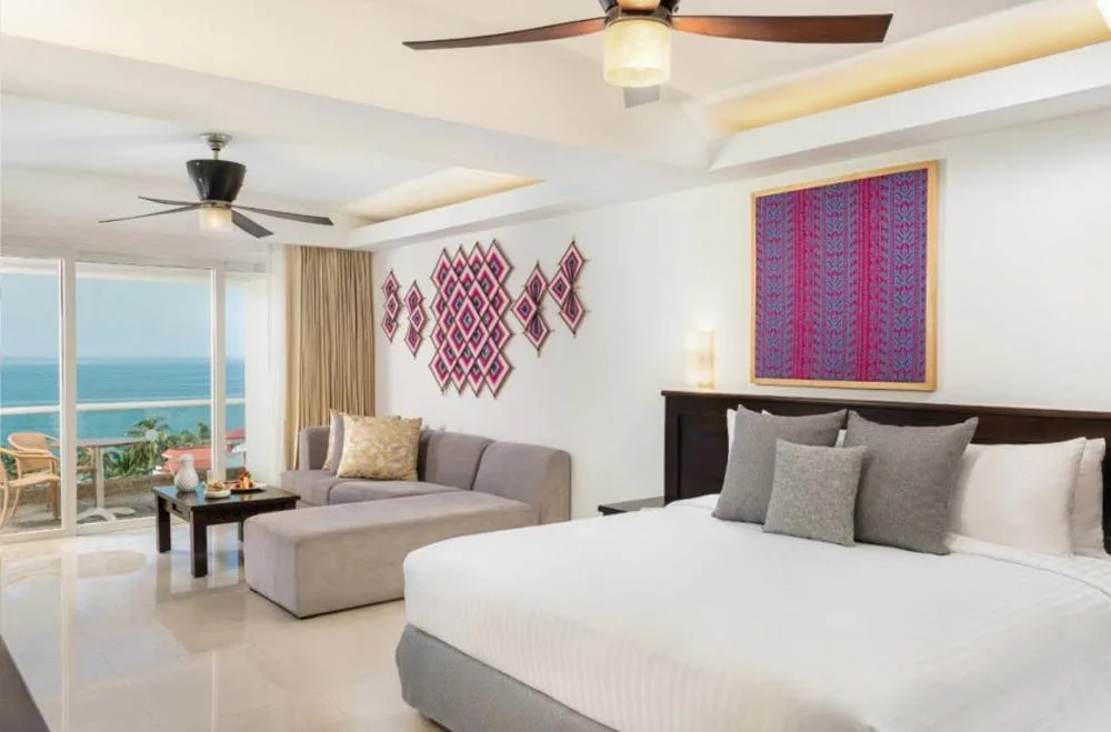 Junior Suite Ocean View at Fiesta Americana Riviera Nayarit Resort & Spa with king bed and sofa seating.