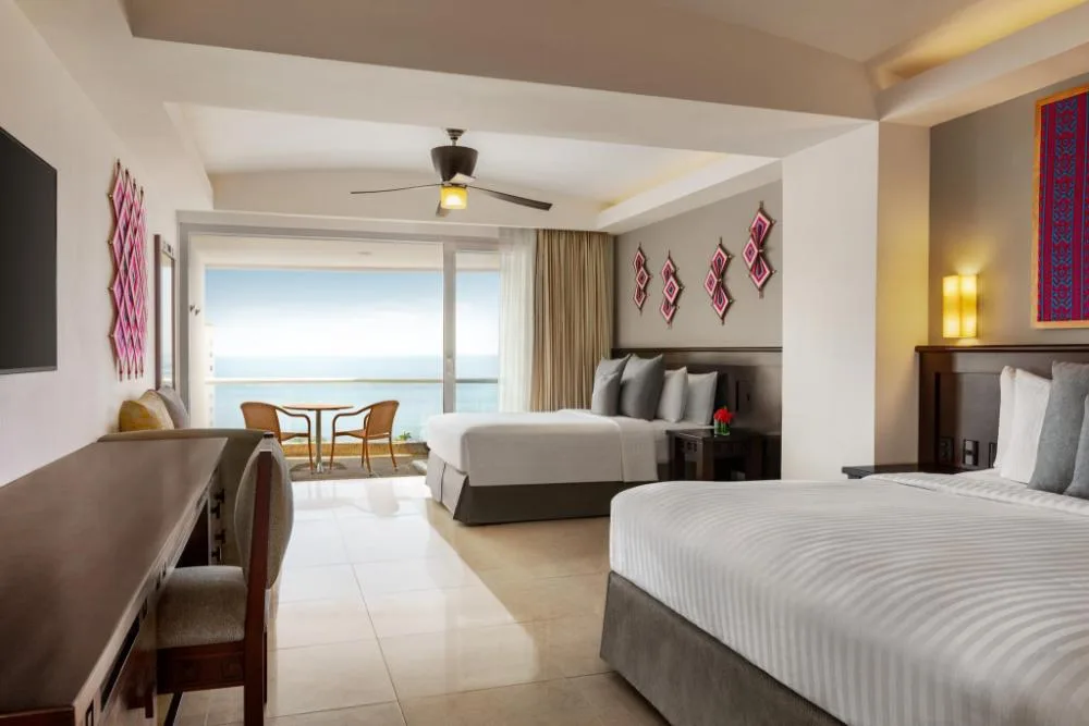 Junior Suite Ocean View at Fiesta Americana Riviera Nayarit Resort & Spa with two beds and ocean balcony.