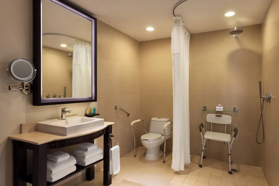 Junior Suite bathroom with vanity, toilet, and shower area at Fiesta Americana Riviera Nayarit Resort & Spa.