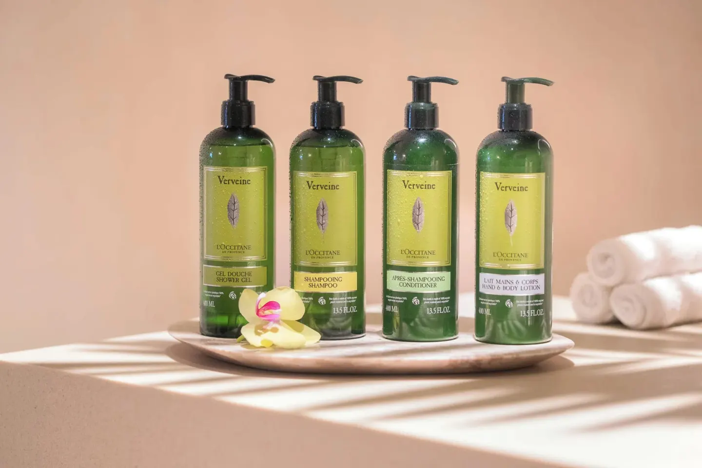 Bathroom amenities and rolled towels in a suite at Finest Playa Mujeres.