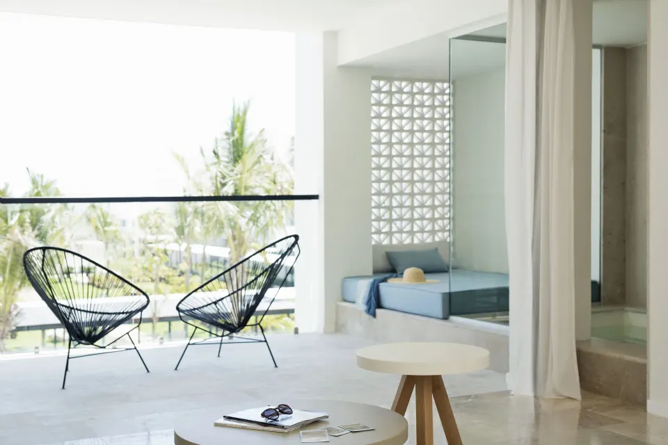 Junior Suite Spa or Pool View balcony seating and soaking tub at Finest Playa Mujeres.