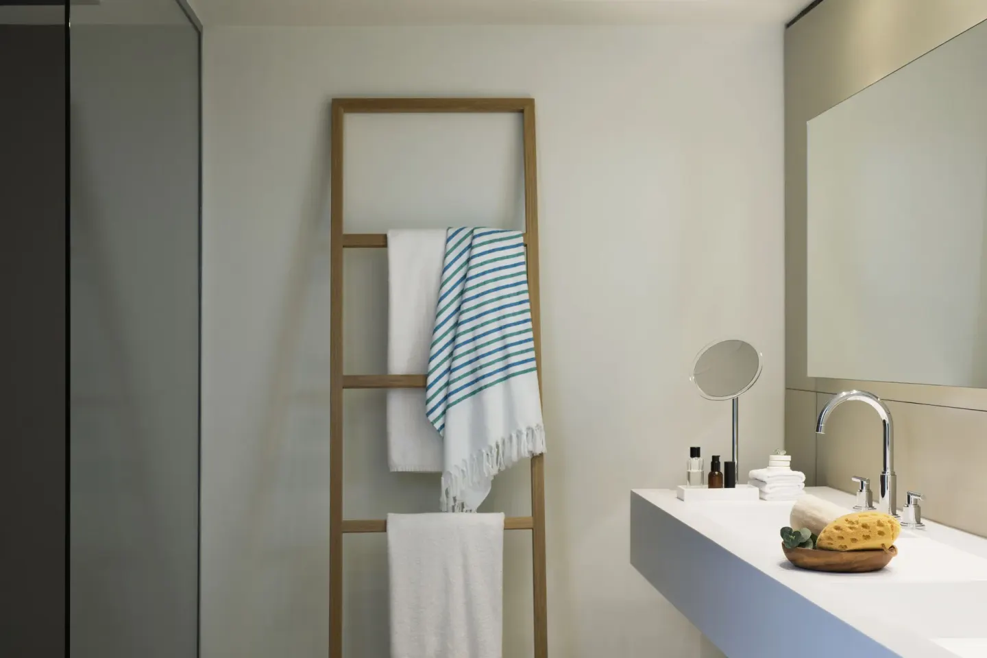 Junior Suite Spa or Pool View bathroom vanity and towel ladder at Finest Playa Mujeres.