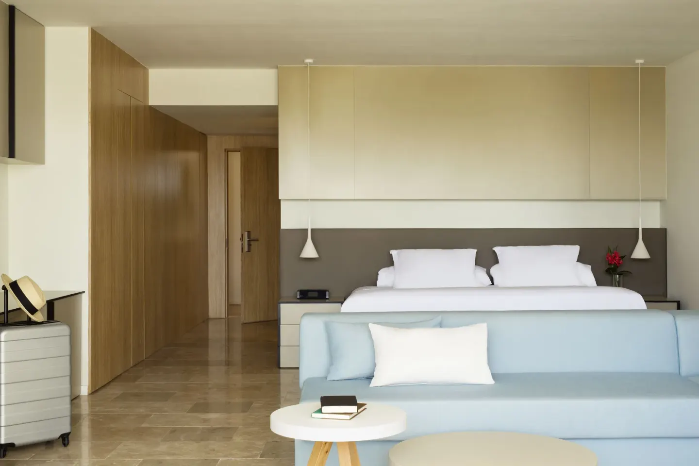 Junior Suite Spa or Pool View with king bed and blue sofa at Finest Playa Mujeres.