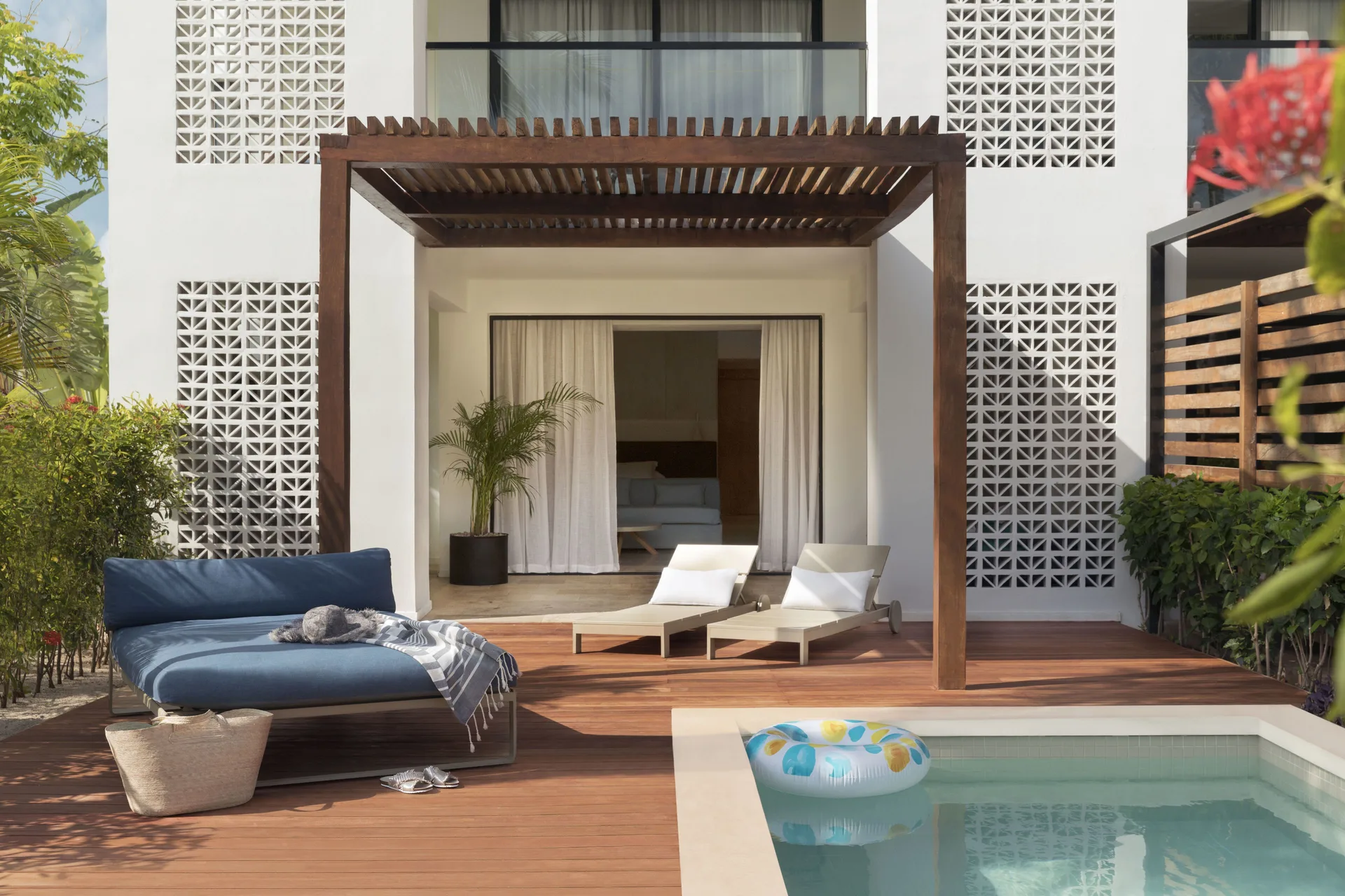 Junior Suite private pool terrace at Finest Playa Mujeres with loungers and shaded patio.