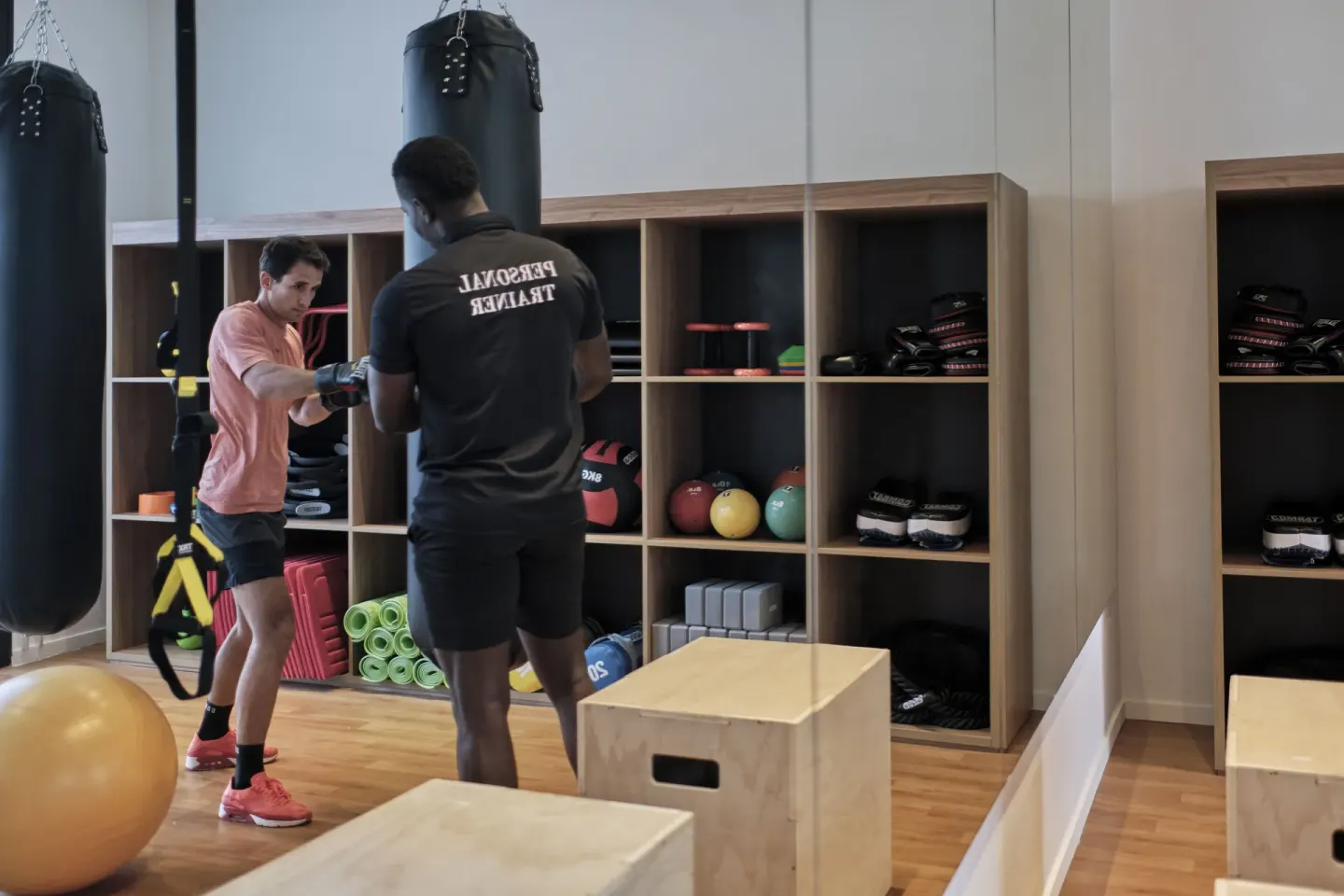 Personal trainer guiding a boxing workout in the gym at Finest Punta Cana.