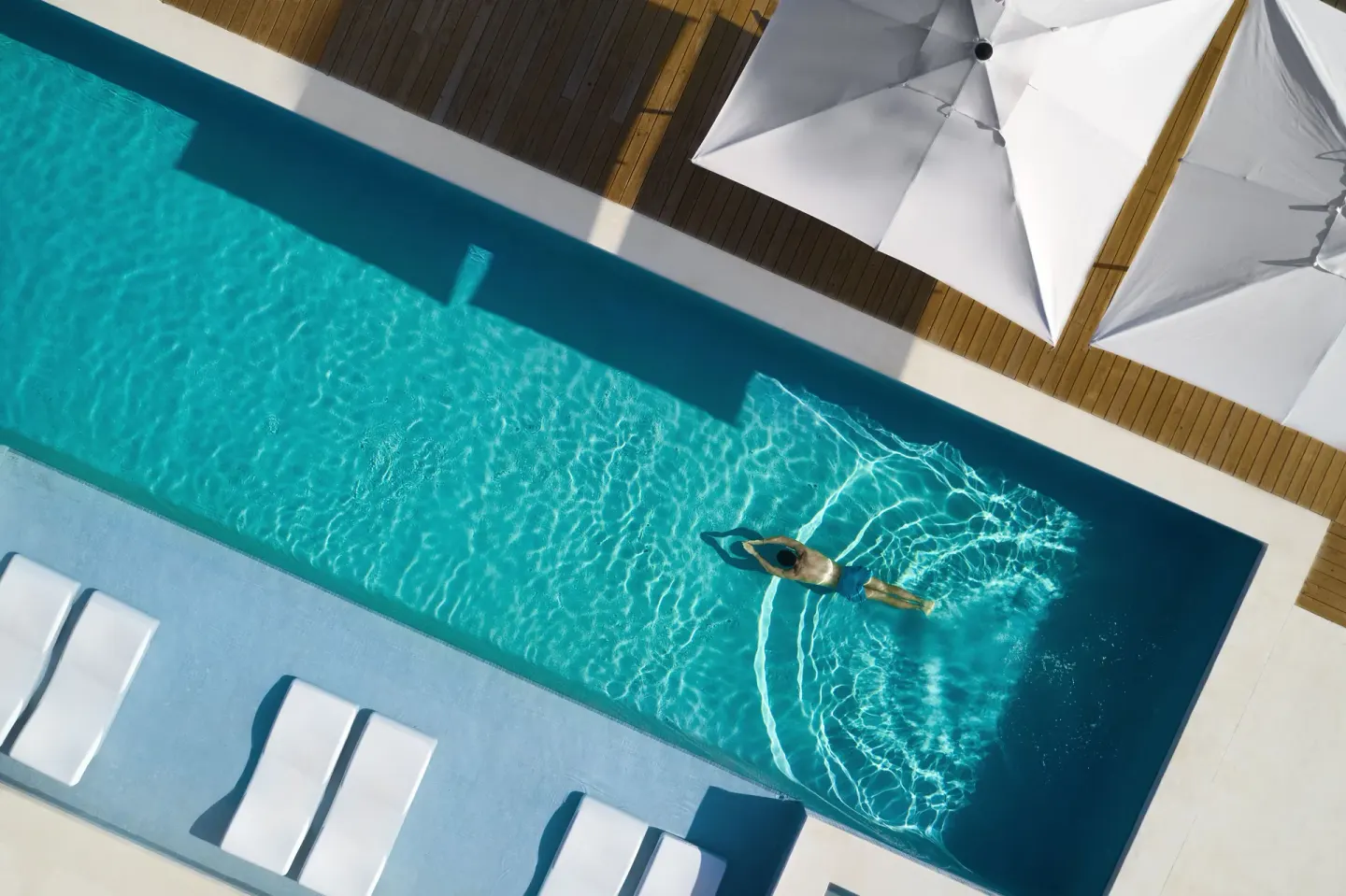 Overhead view of a guest swimming in a narrow pool at Finest Punta Cana.