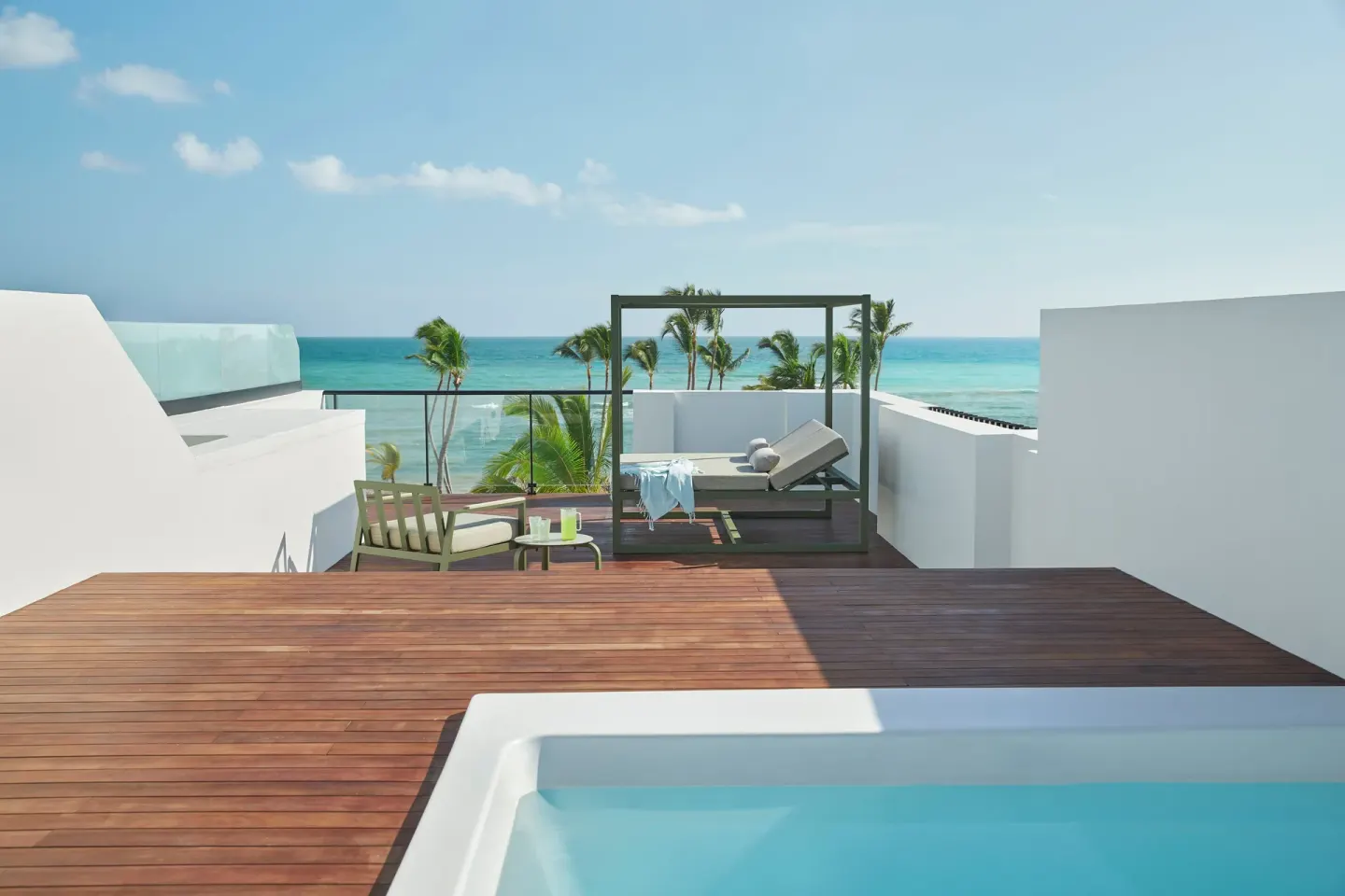 Rooftop terrace with plunge pool, daybed, and ocean view at Finest Punta Cana.