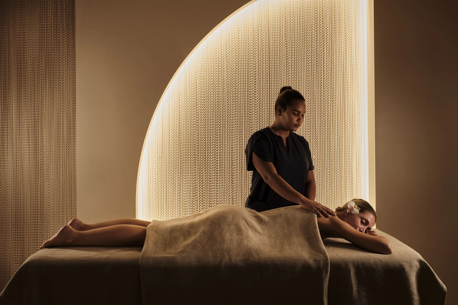 Massage treatment in a softly lit spa room at Finest Punta Cana.