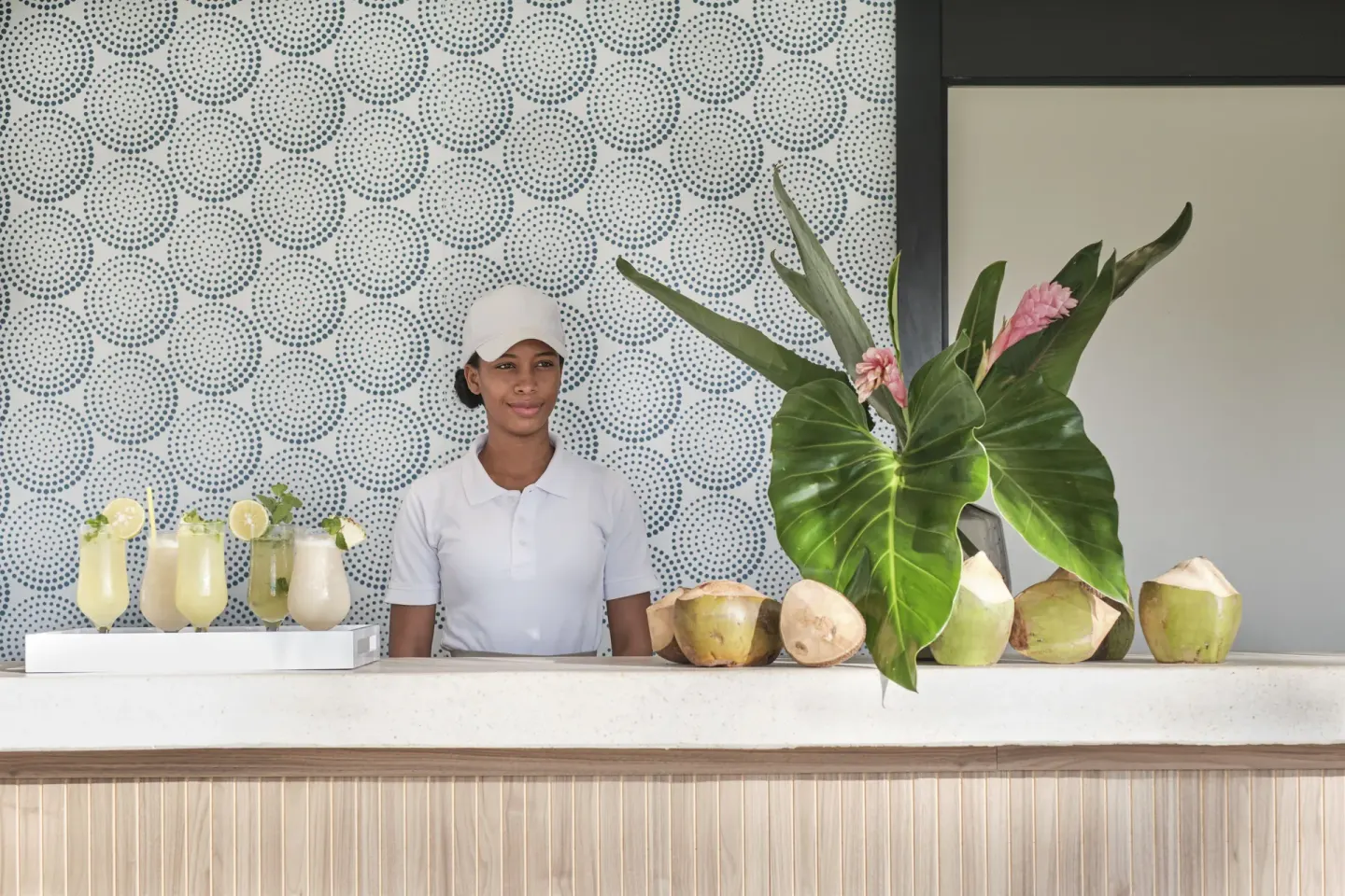 Juice bar counter with tropical drinks and fresh coconuts at Finest Punta Cana.