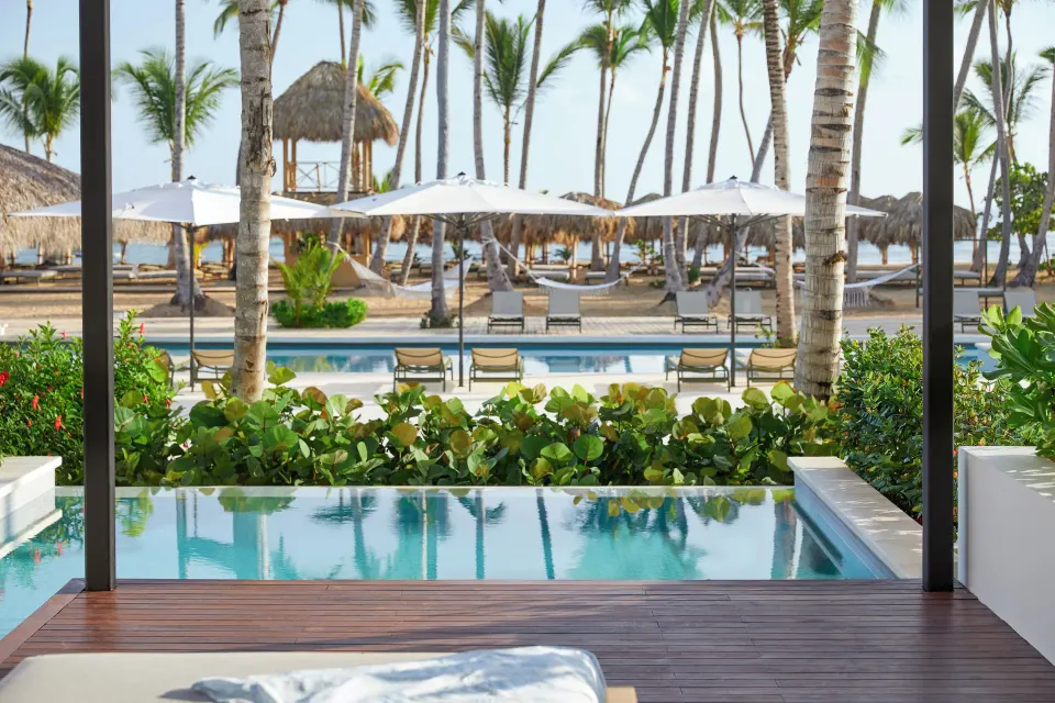 Private pool terrace overlooking palms and the beach at Finest Punta Cana.