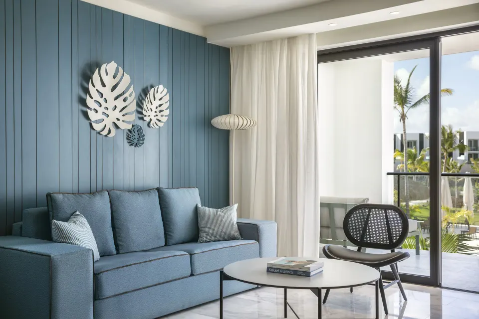 Junior Suite Garden or Pool View sitting area with balcony at Finest Punta Cana.