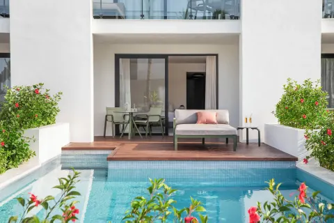 Junior Suite private pool terrace with daybed and dining area at Finest Punta Cana.