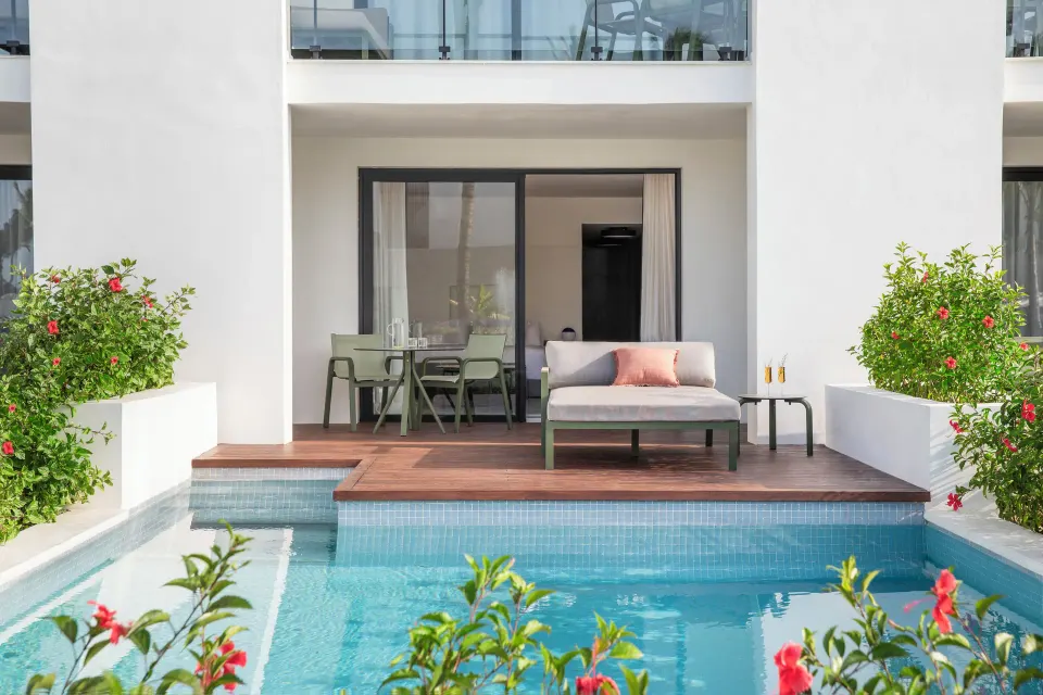 Junior Suite private pool terrace with daybed and dining area at Finest Punta Cana.