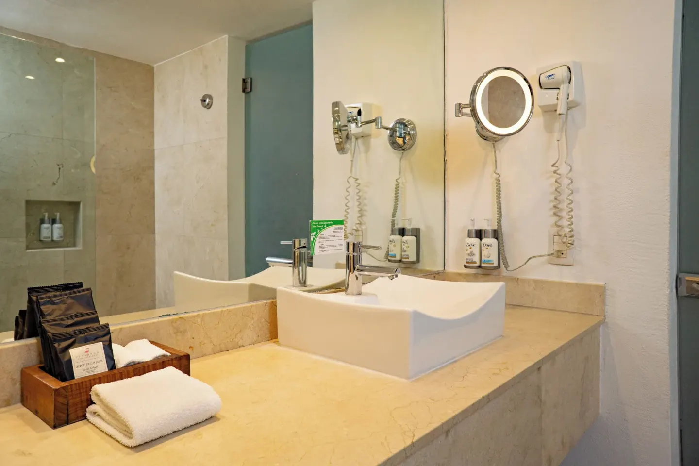 Deluxe Pool Terrace Walkout bathroom vanity with sink and mirror at Flamingo Cancun.