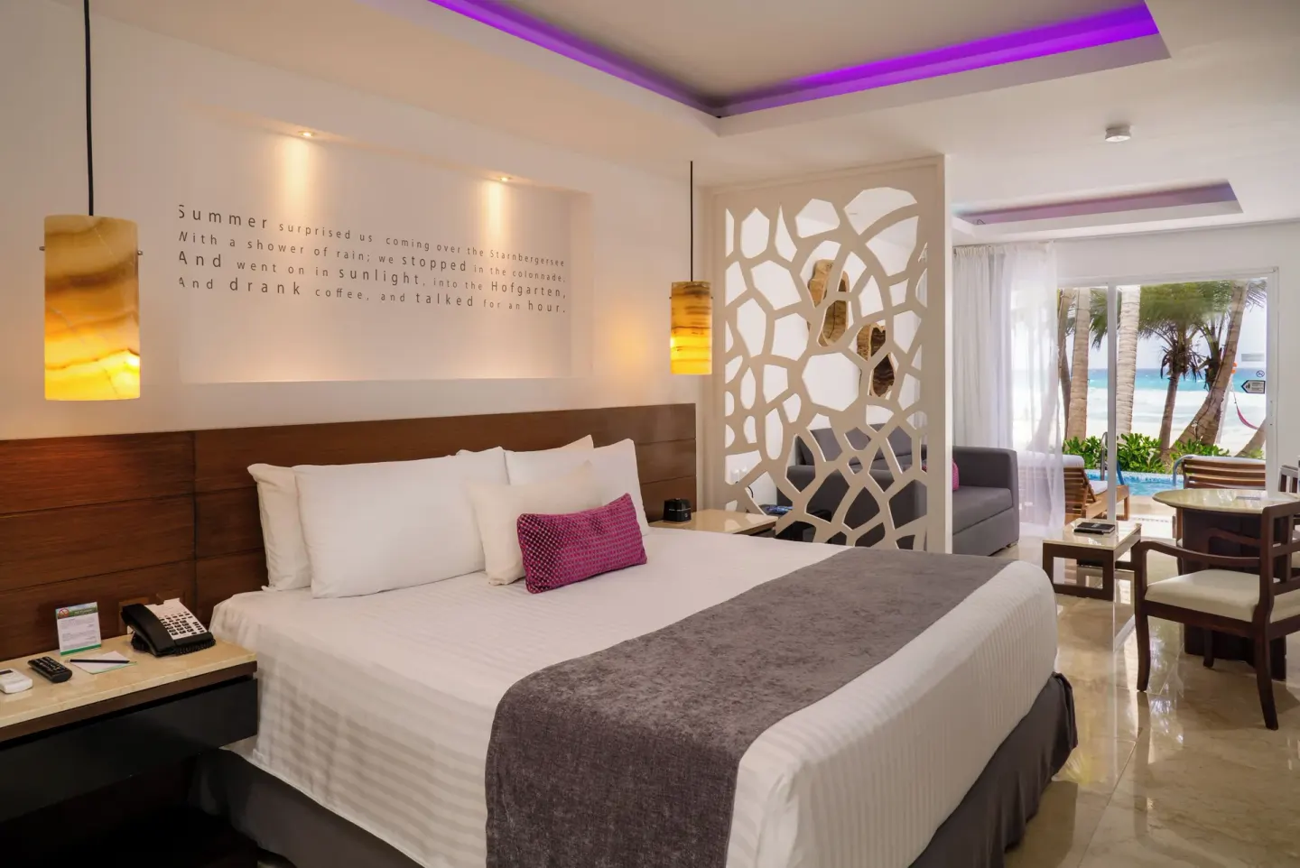 Jr Suite Swim Up Ocean View king bed and patio at Flamingo Cancun.