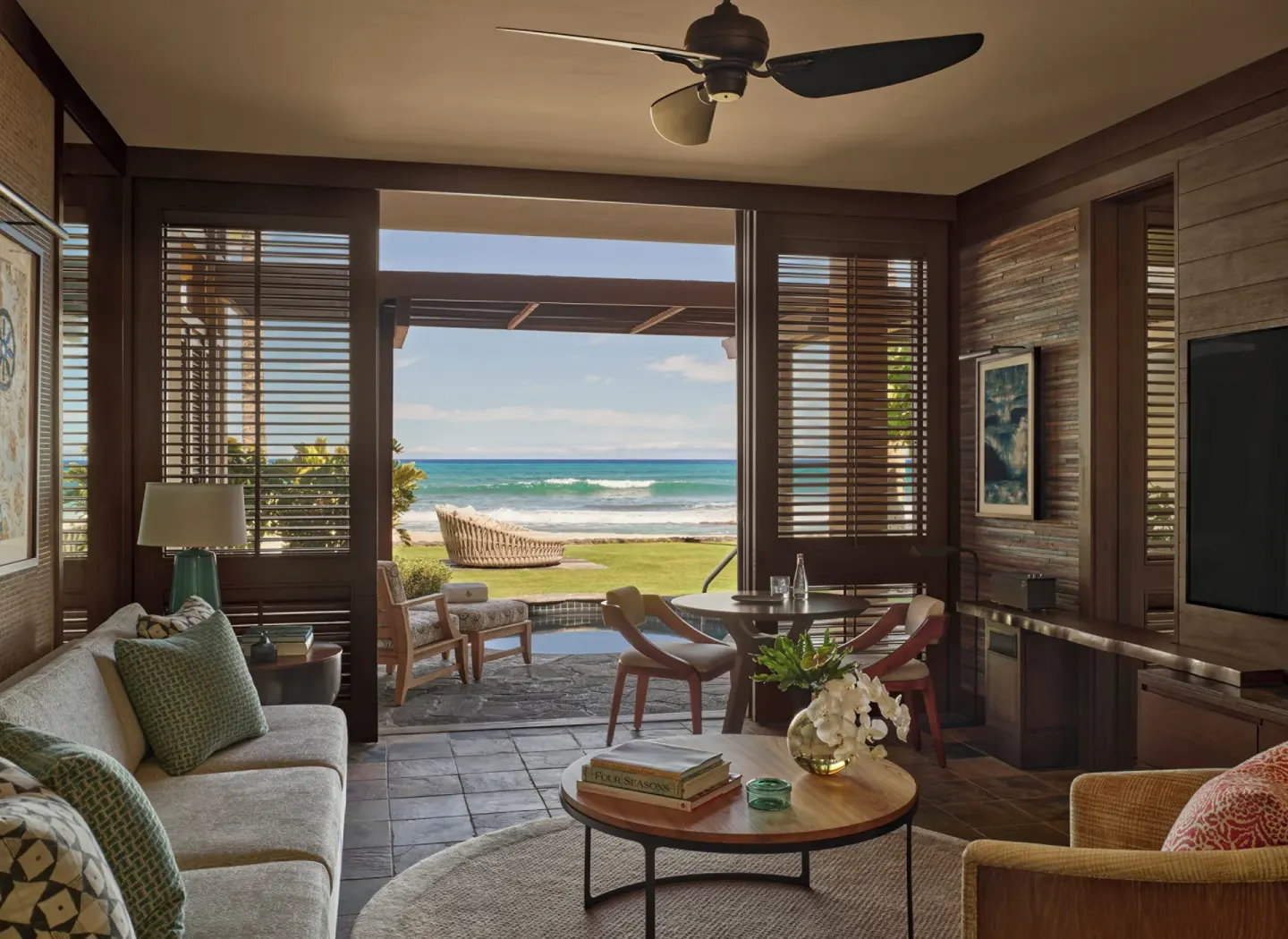 Beachfront suite sitting room with ocean view at Four Seasons Resort Hualalai.