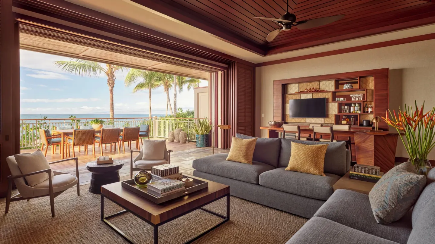 Spacious ocean-view living room and lanai at Four Seasons Resort Hualalai.