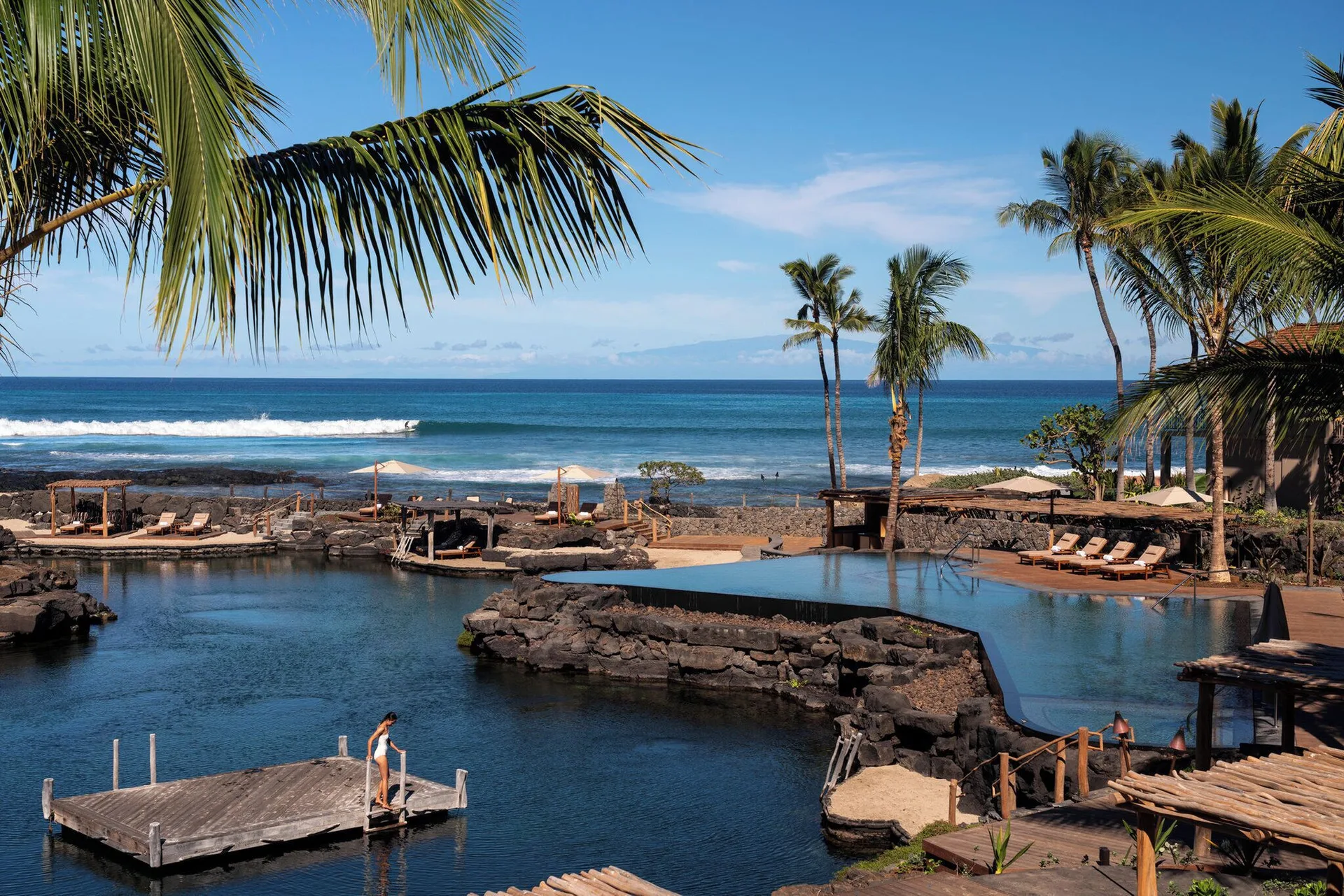 Oceanfront pools and a swimming lagoon at Four Seasons Resort Hualalai.