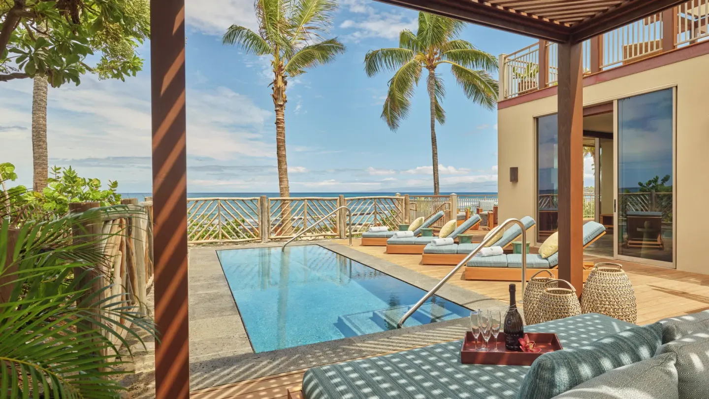 Private oceanfront pool terrace with loungers at Four Seasons Resort Hualalai.