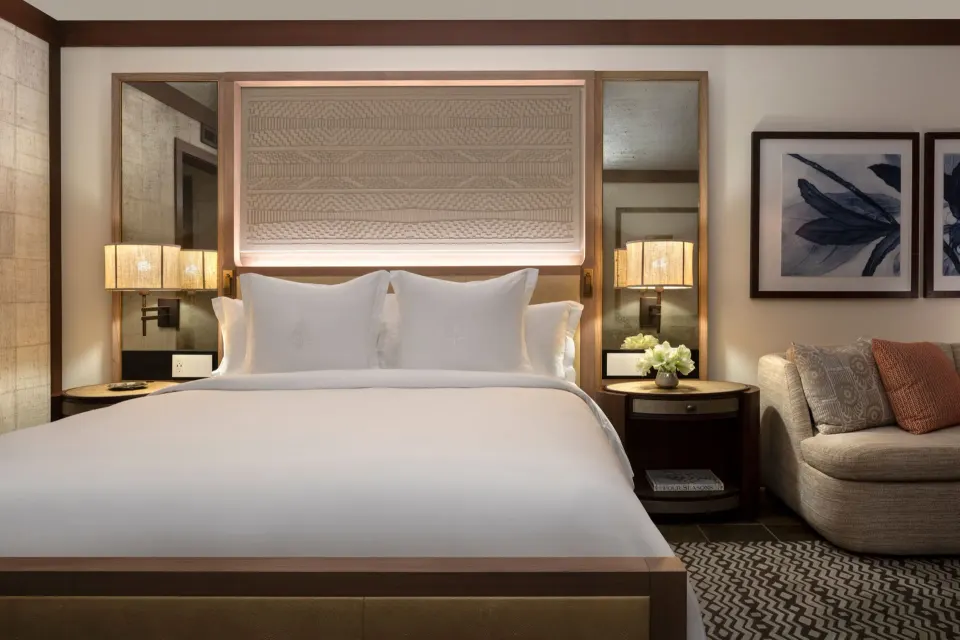 Deluxe Room king bed and sofa bed at Four Seasons Resort Hualalai.
