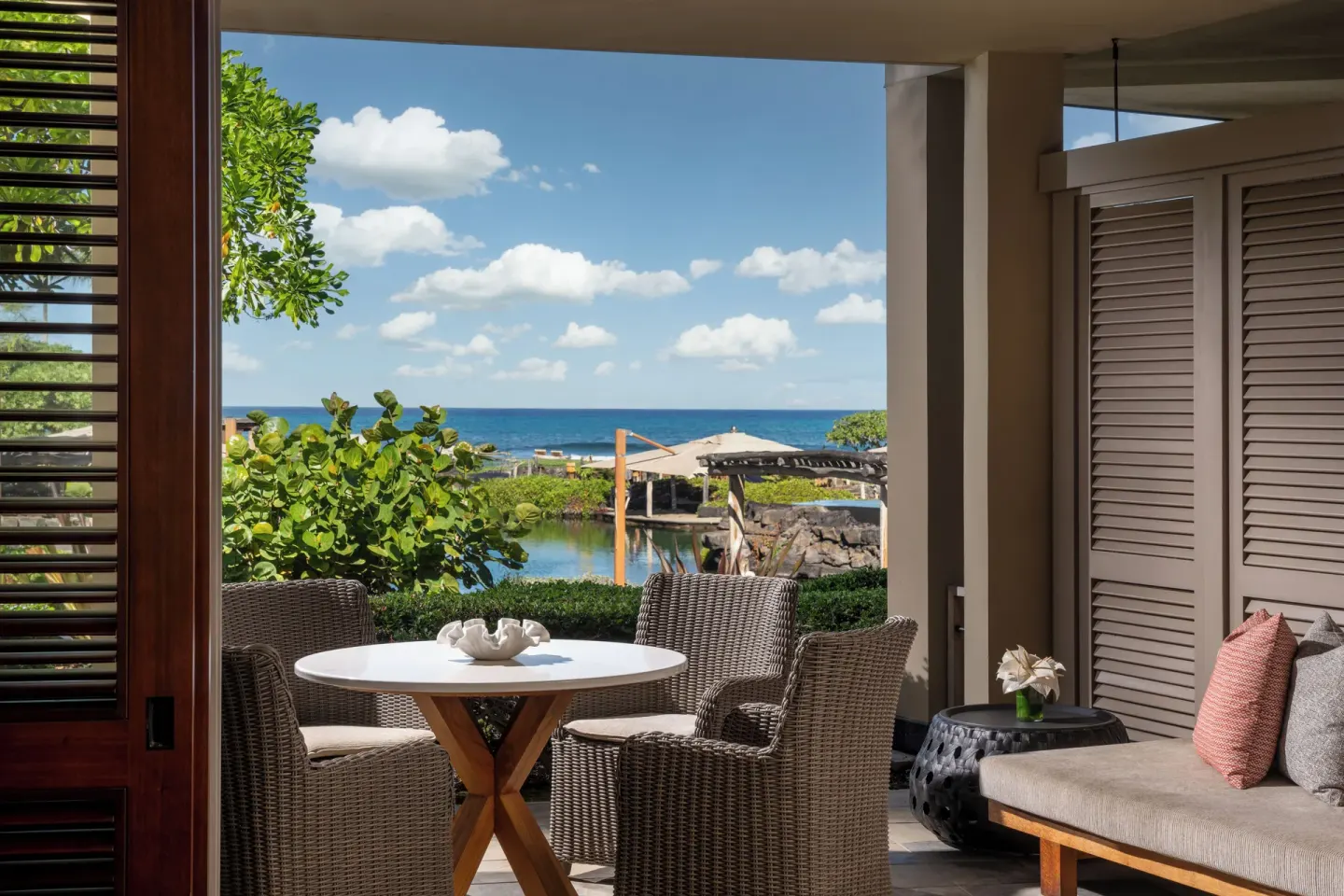 Deluxe Room lanai with ocean view at Four Seasons Resort Hualalai.