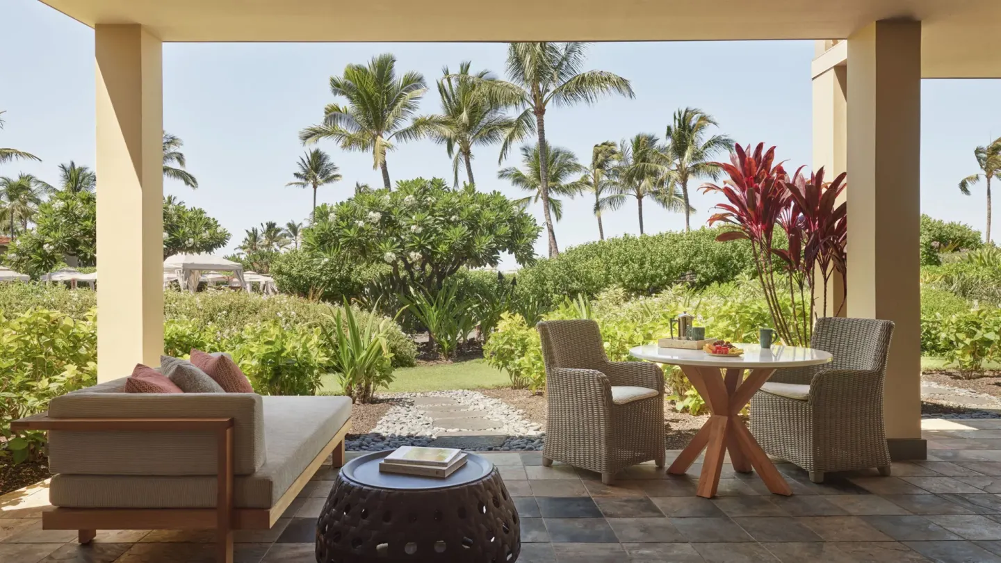 Covered garden patio of an ohana family suite at Four Seasons Resort Hualalai.