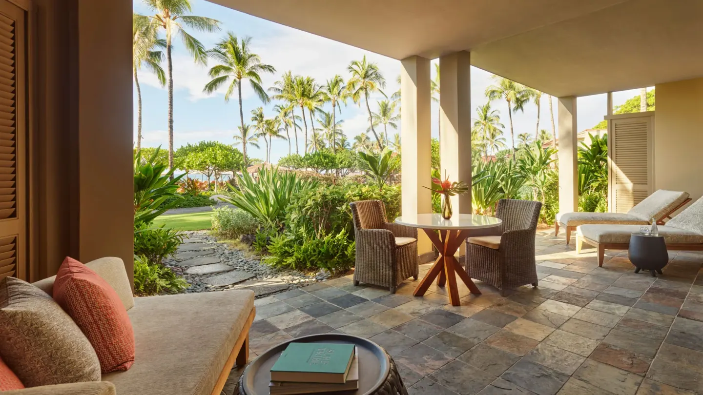 Garden terrace seating for an ohana family suite at Four Seasons Resort Hualalai.