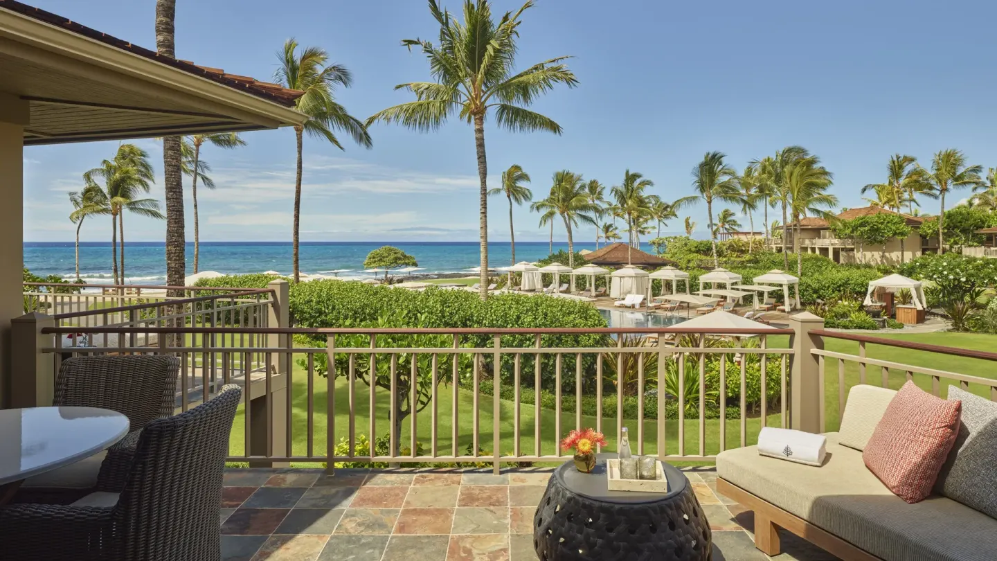 Furnished ocean-view lanai for a Deluxe One-Bedroom Suite at Four Seasons Resort Hualalai.