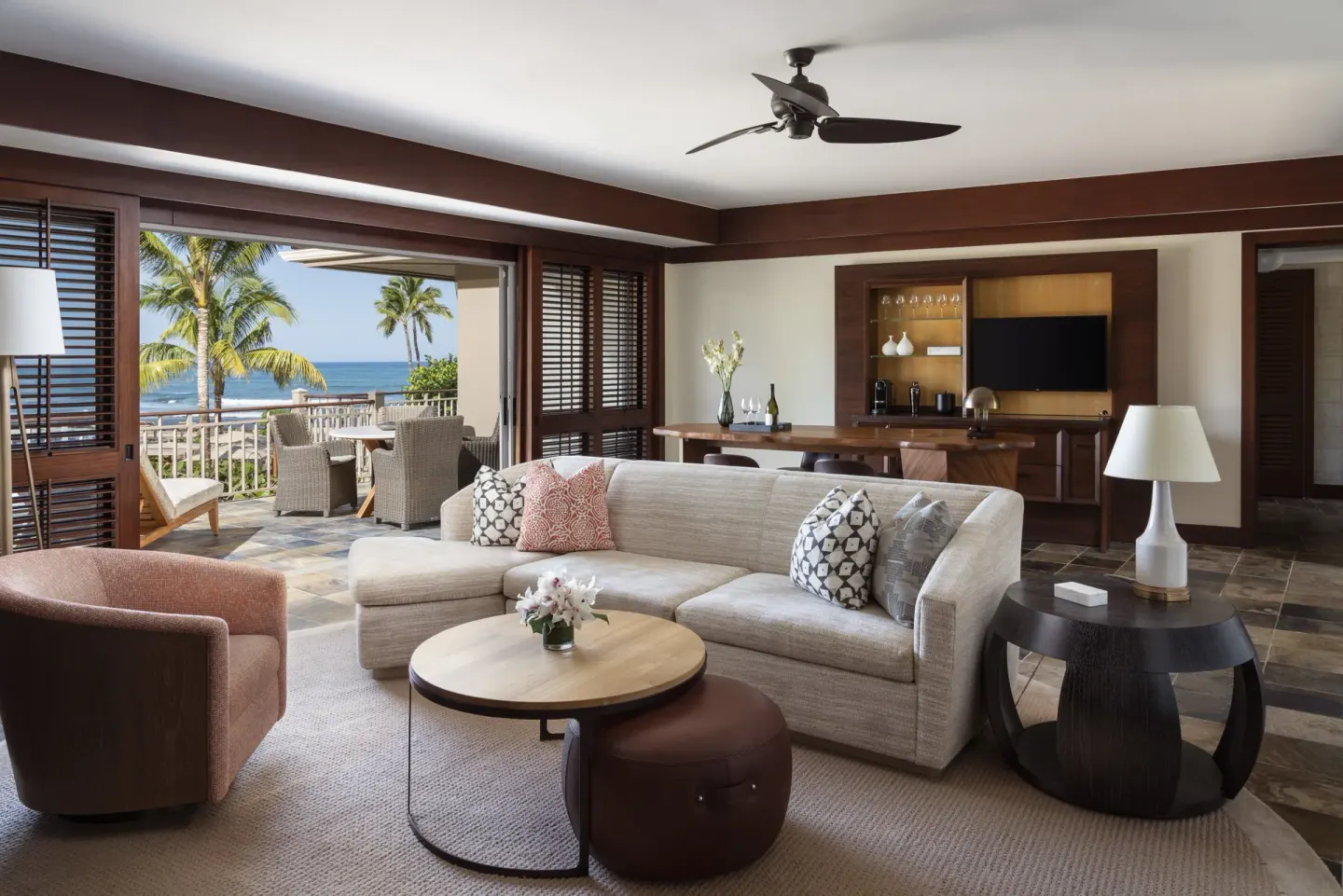 Ocean-view living room in a Deluxe One-Bedroom Suite at Four Seasons Resort Hualalai.
