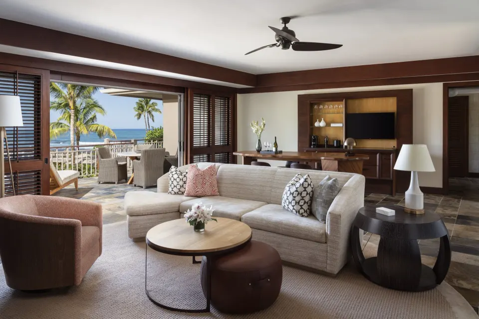 Ocean-view living room in a Deluxe One-Bedroom Suite at Four Seasons Resort Hualalai.