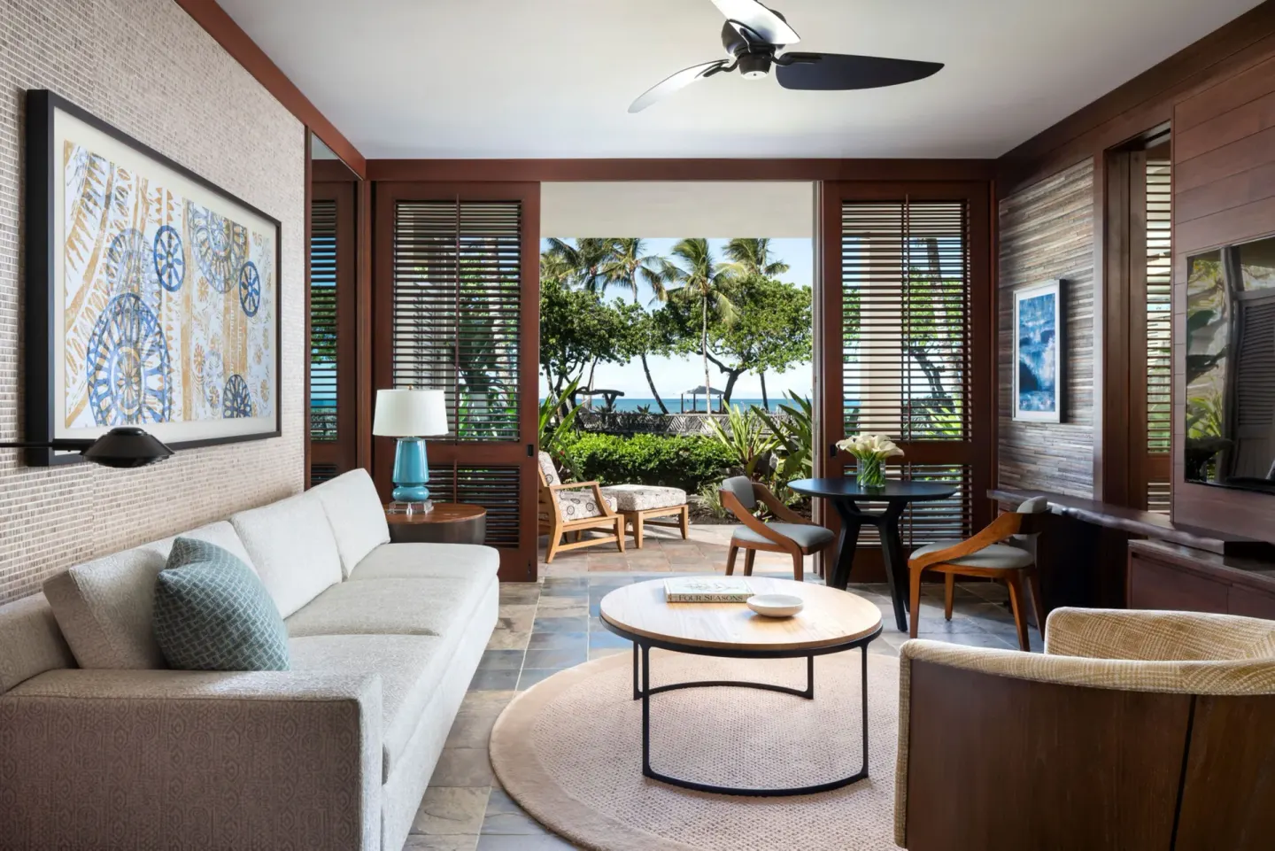 Superior Suite ocean-view living room and lanai at Four Seasons Resort Hualalai.