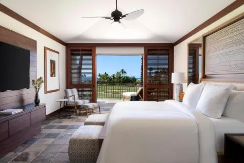 Superior Suite Ocean Golf View bedroom with terrace at Four Seasons Resort Hualalai.