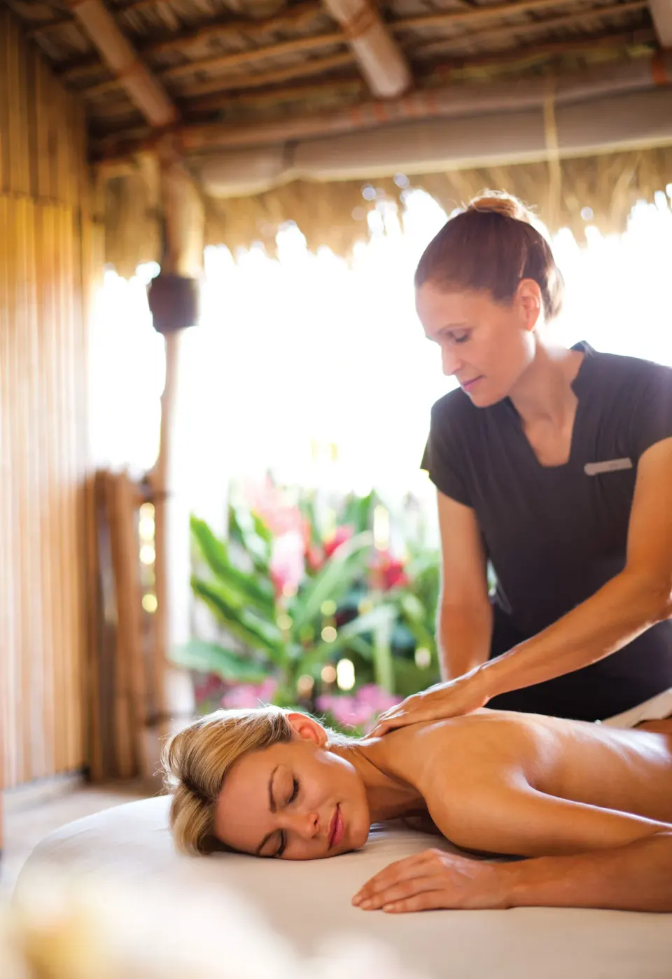 Massage treatment in a thatched spa cabana at Four Seasons Resort Maui at Wailea.