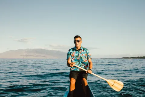 A canoe paddler crosses the ocean near Four Seasons Resort Maui at Wailea.
