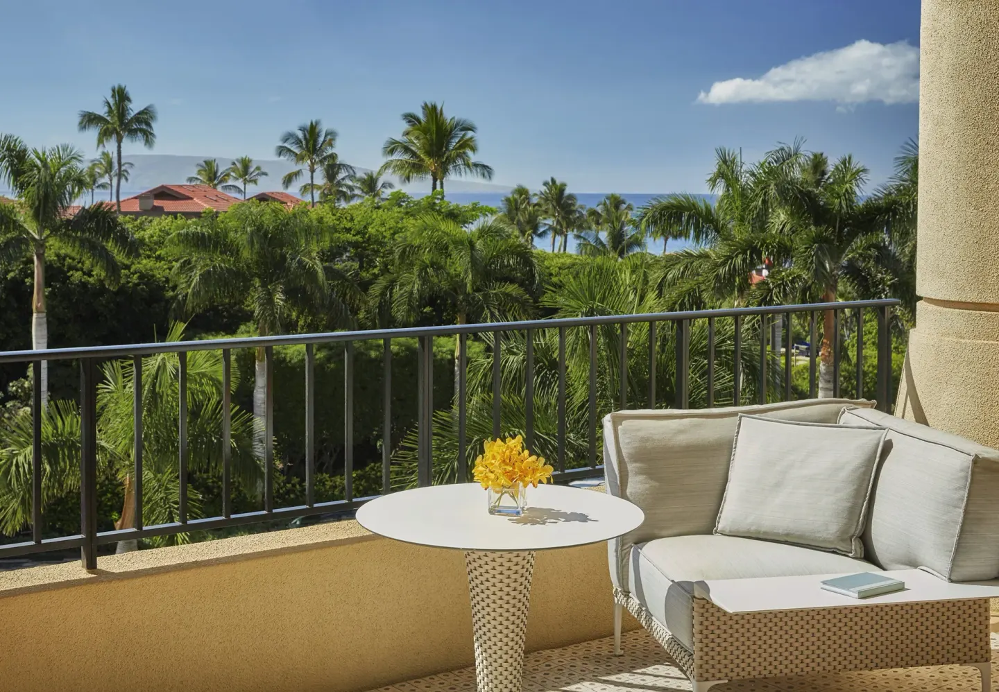 Balcony seating in a Deluxe Garden View Executive Suite at Four Seasons Resort Maui at Wailea.