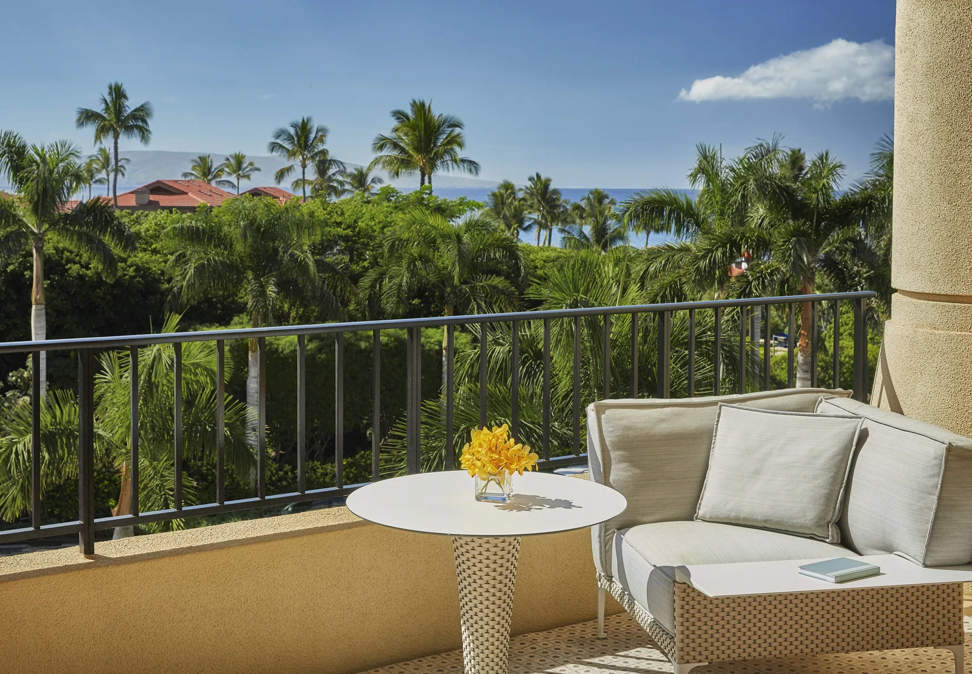 Balcony seating in a Deluxe Garden View Executive Suite at Four Seasons Resort Maui at Wailea.