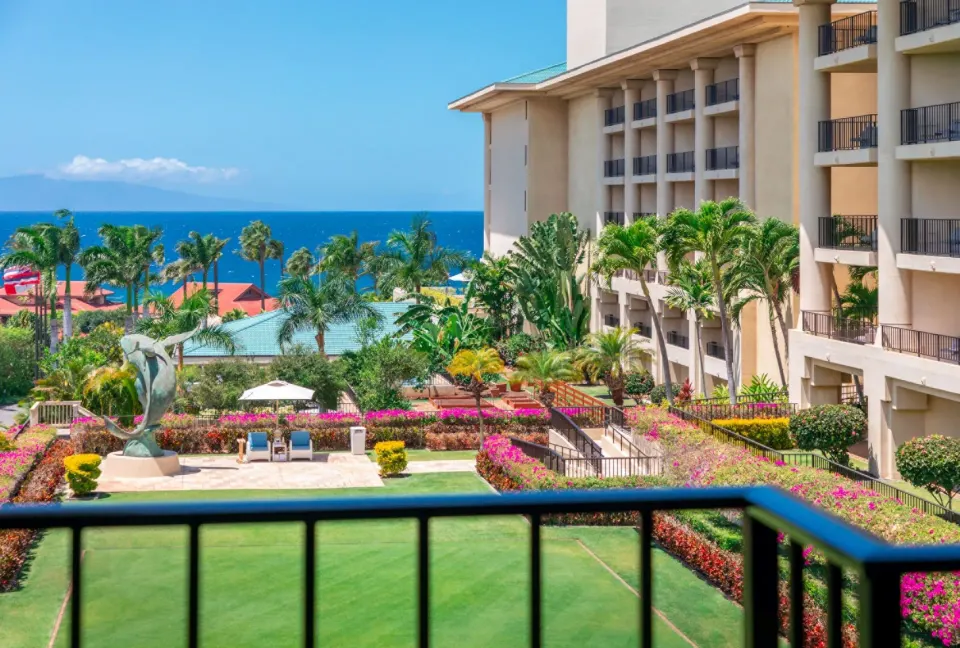Deluxe Ocean View Room balcony view of gardens and ocean at Four Seasons Resort Maui at Wailea.