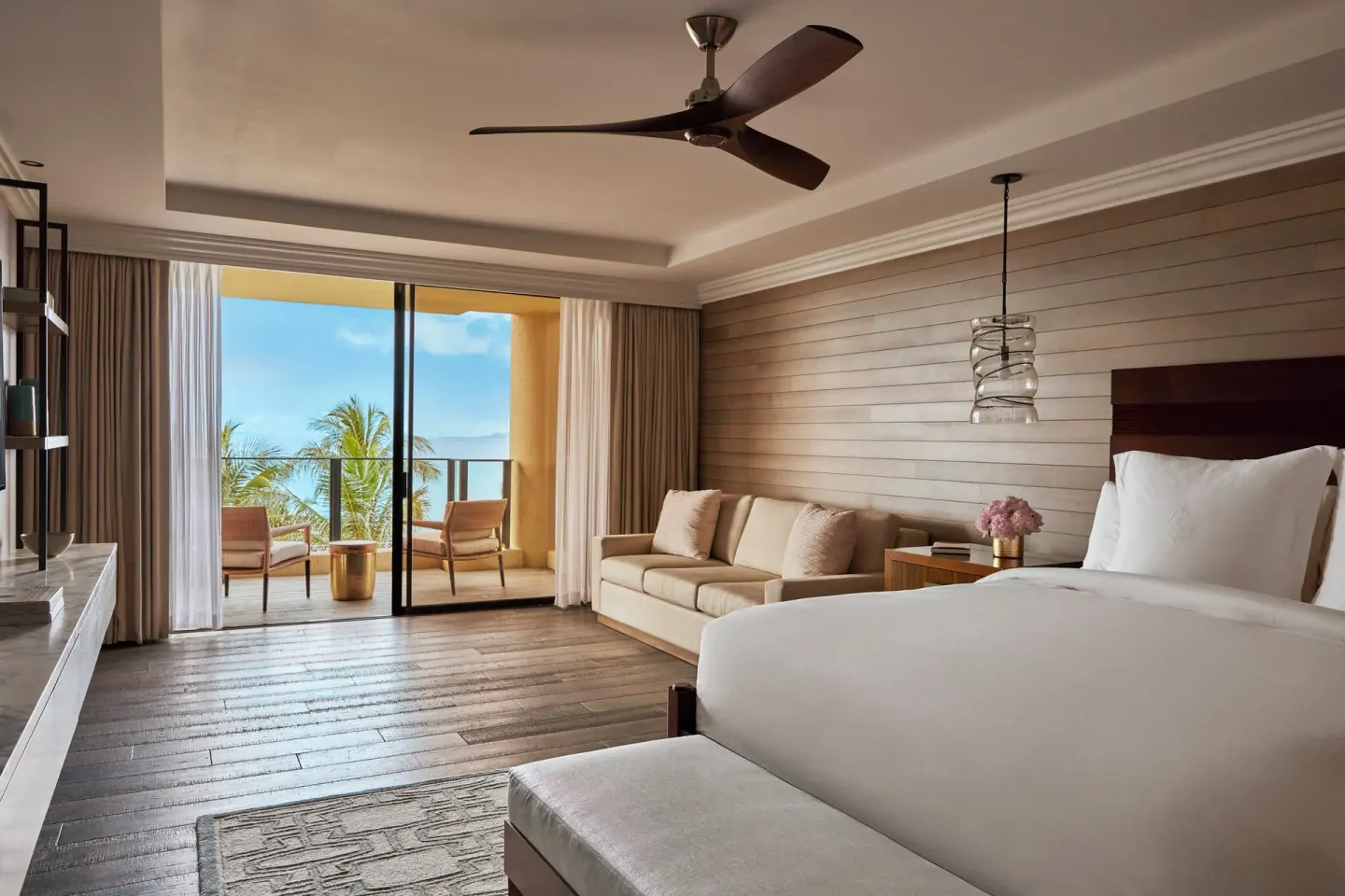 Elite Ocean Front Two Bedroom Suite bedroom at Four Seasons Resort Maui at Wailea with lanai and ocean view.