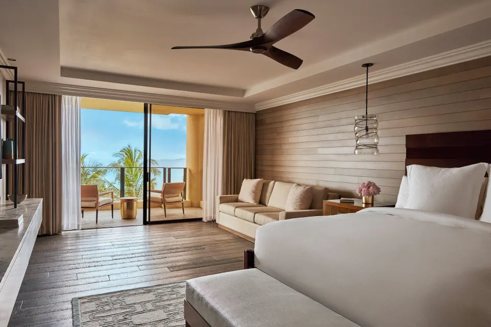 Elite Ocean Front Two Bedroom Suite bedroom at Four Seasons Resort Maui at Wailea with lanai and ocean view.
