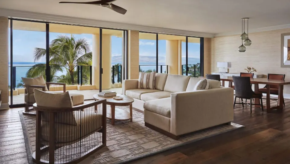 Elite Ocean Front Two Bedroom Suite sitting and dining area at Four Seasons Resort Maui at Wailea with lanai views.