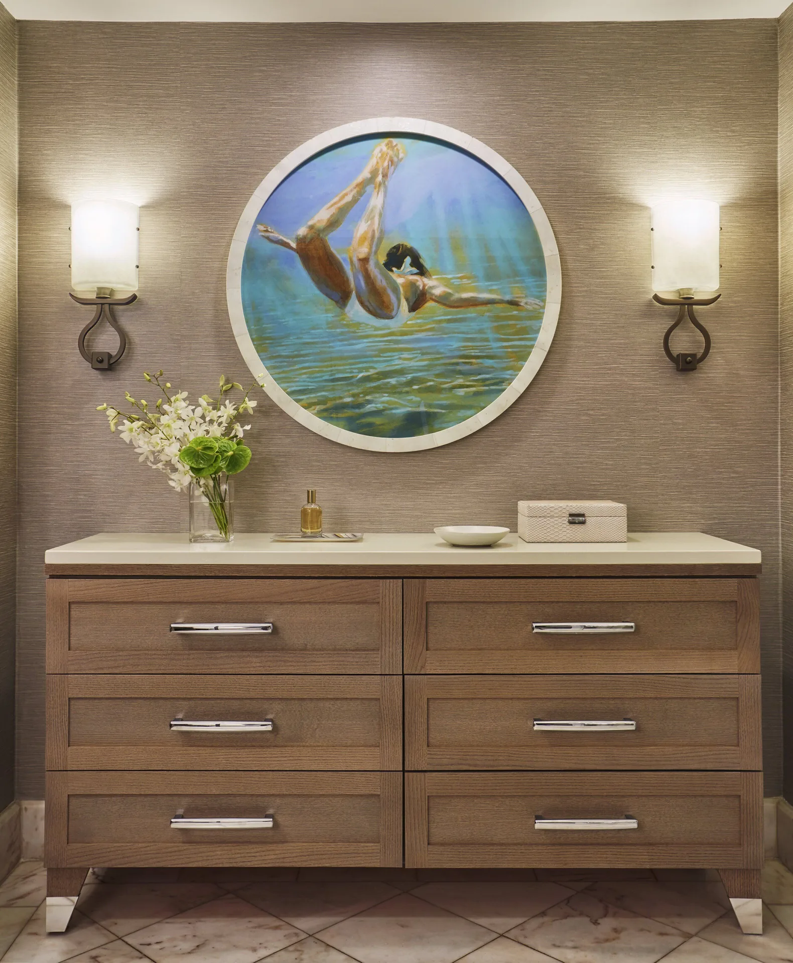 Garden View Accessible Room dresser at Four Seasons Resort Maui at Wailea with wall sconces and round artwork.