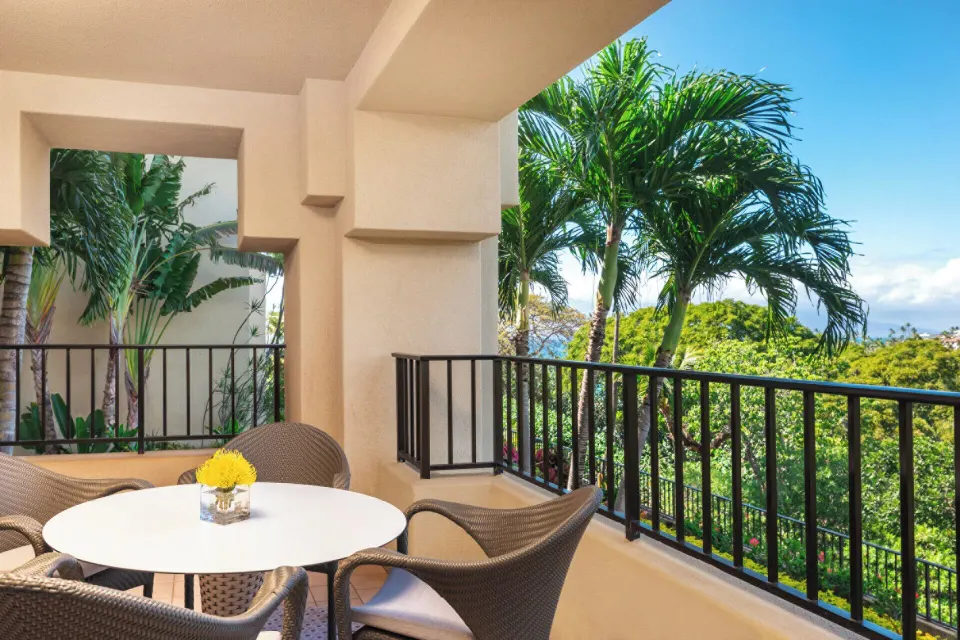 Garden View Executive Suite balcony with palm views at Four Seasons Resort Maui at Wailea.