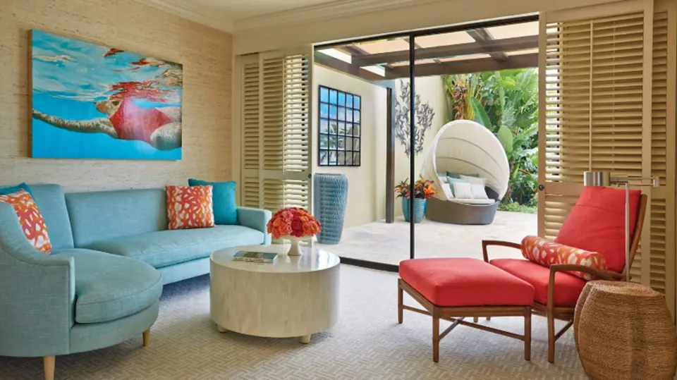 Lokelani Presidential Suite sitting area opening to garden patio at Four Seasons Resort Maui at Wailea.