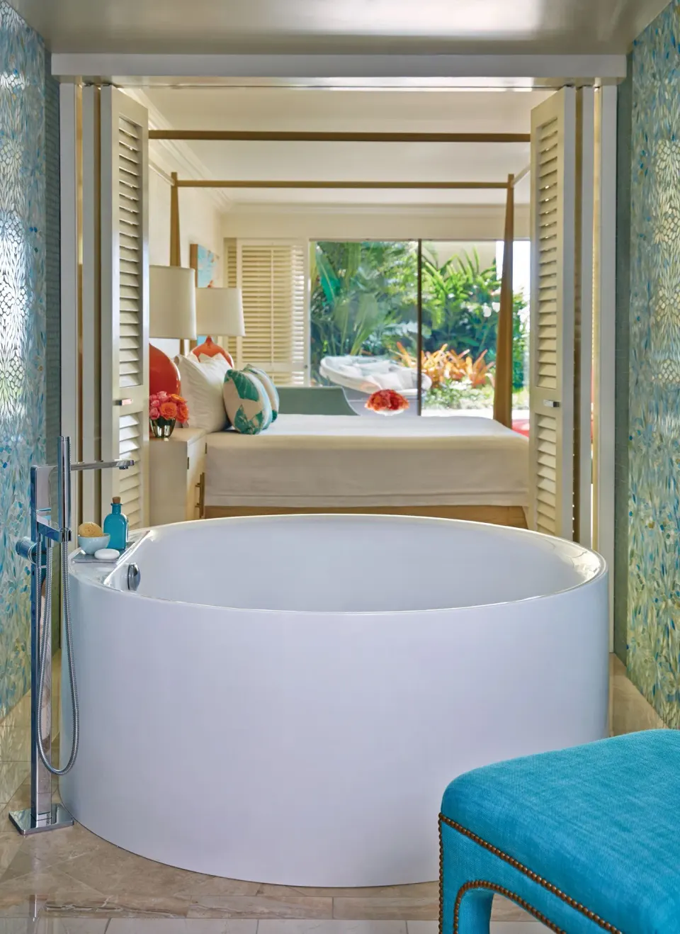 Lokelani Presidential Suite soaking tub beside a bedroom at Four Seasons Resort Maui at Wailea.
