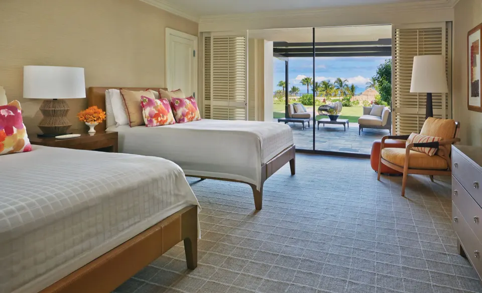 Lokelani Presidential Suite bedroom with two beds and patio at Four Seasons Resort Maui at Wailea.