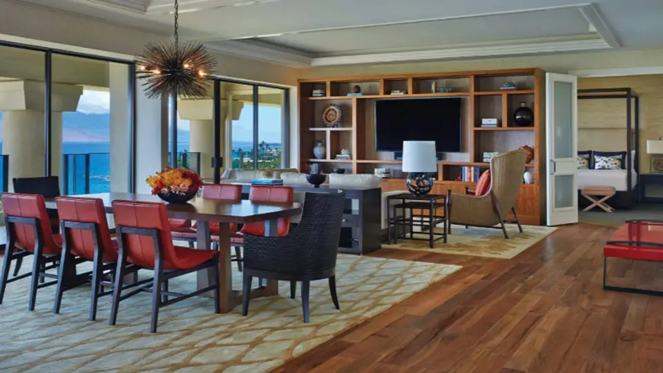 Maile Presidential Suite dining area and lounge with ocean view at Four Seasons Resort Maui at Wailea.