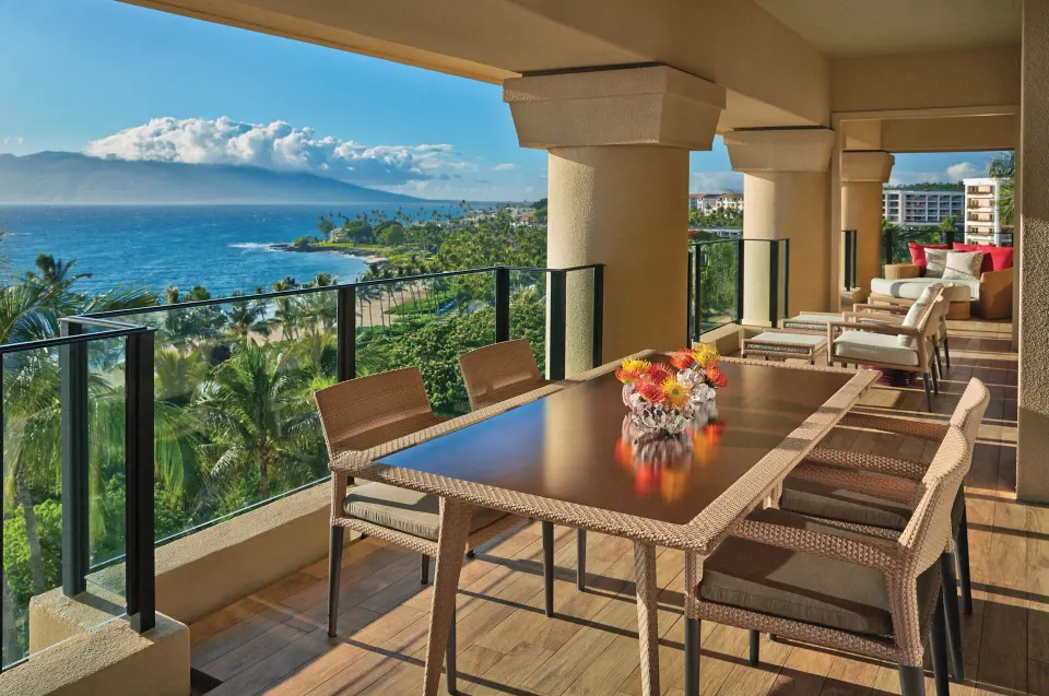 Maile Presidential Suite furnished lanai with coastal view at Four Seasons Resort Maui at Wailea.