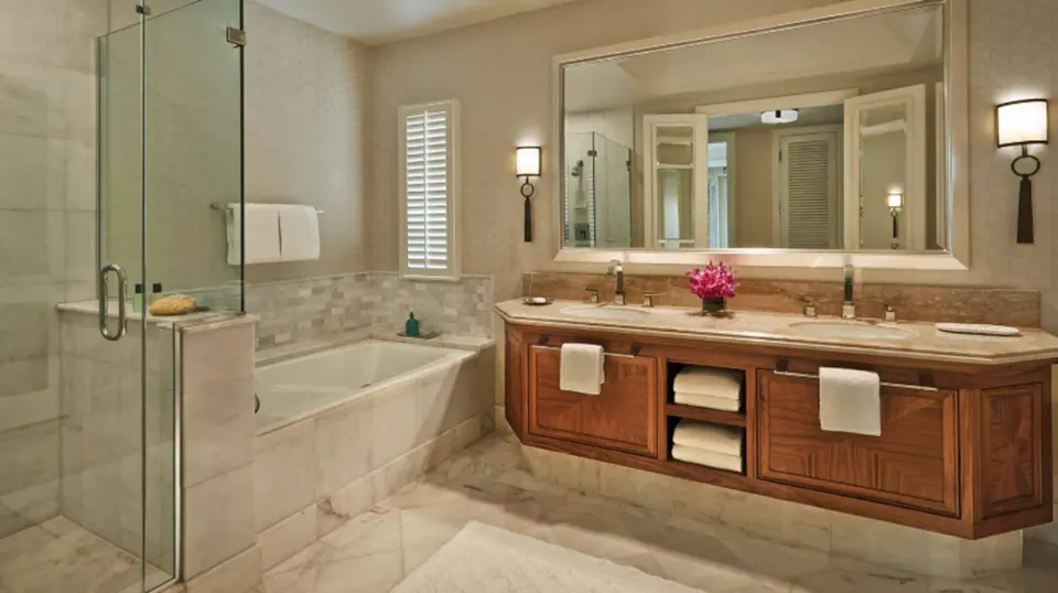Maile Presidential Suite marble bathroom with tub at Four Seasons Resort Maui at Wailea.