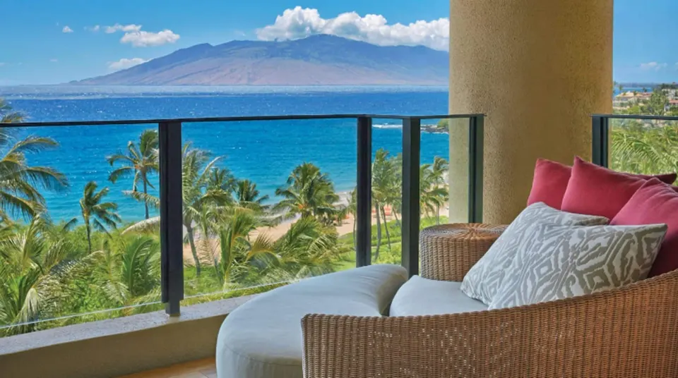 Maile Presidential Suite terrace daybed overlooking ocean at Four Seasons Resort Maui at Wailea.